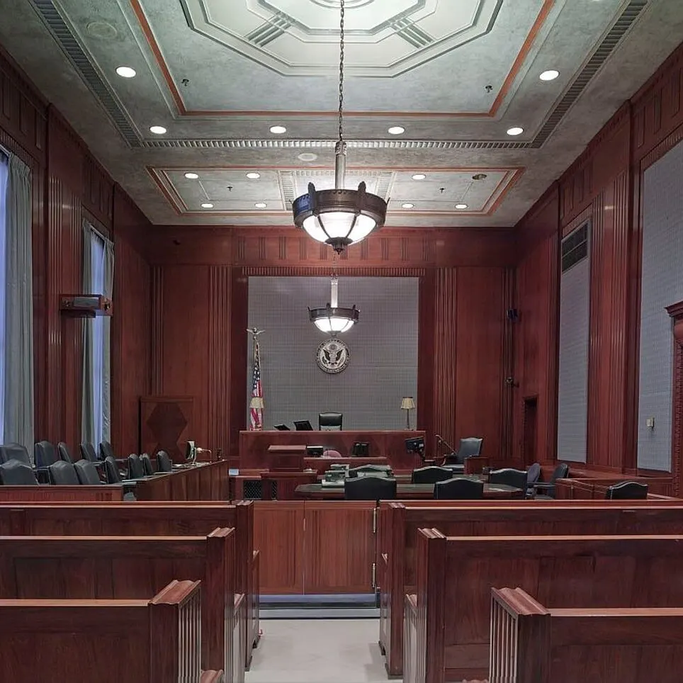 An empty New York courtroom, the forum a severance release signs away